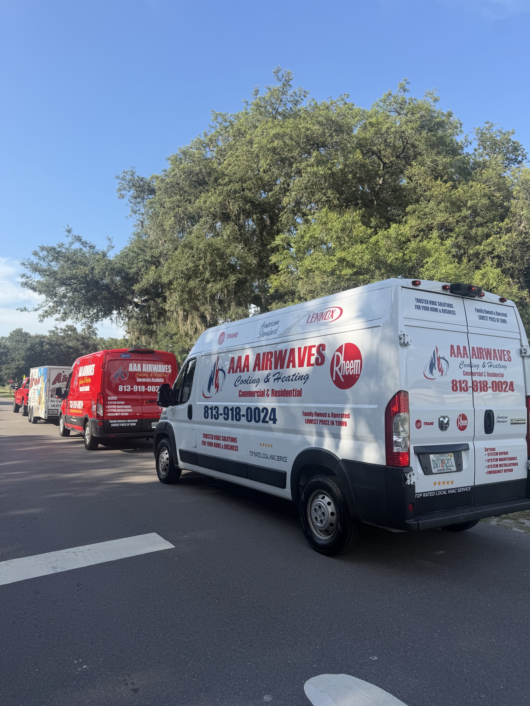 AAA Airwaves technician servicing a Trane rooftop HVAC unit